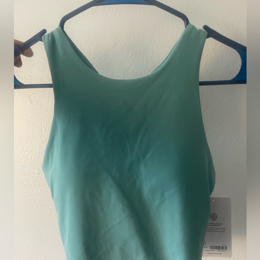 Light blue Athleta workout top. Never worn with tags. Size small.